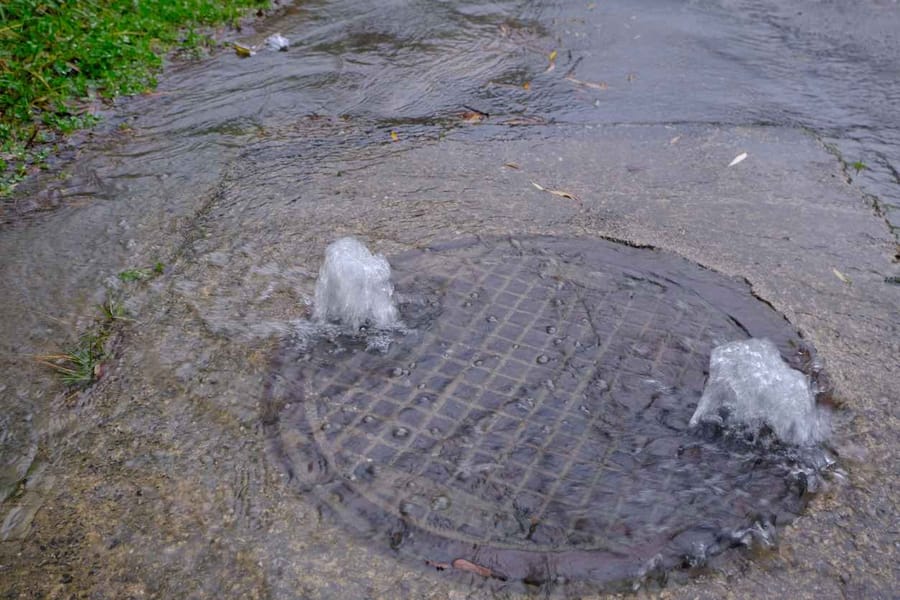 Water overflowing from the sewage systems due to rain