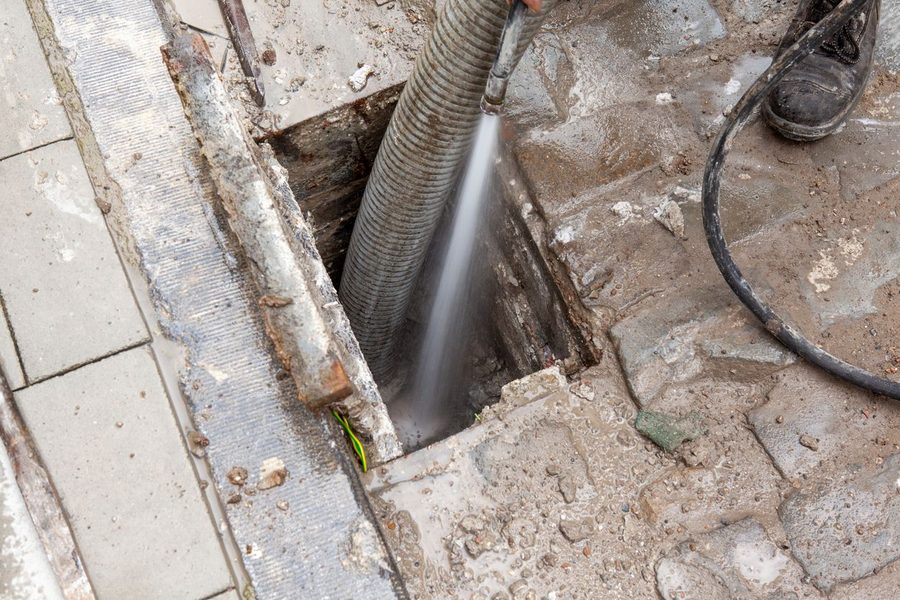 Plumber using hydro jetting technology